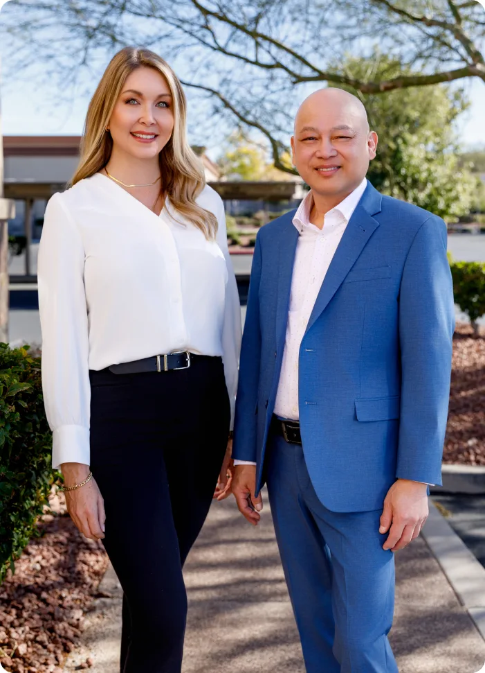 Dr. Timothy Luong standing outdoors with a team member in front of a building in Henderson NV