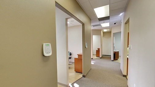 The left panel of the Ascend Dental Studio office interior showing a bright and clean treatment room in Henderson NV