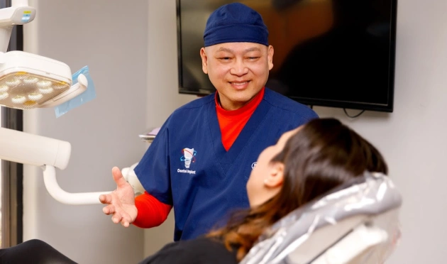 Dentist discussing preventive dentistry treatment with a patient at a dental clinic
