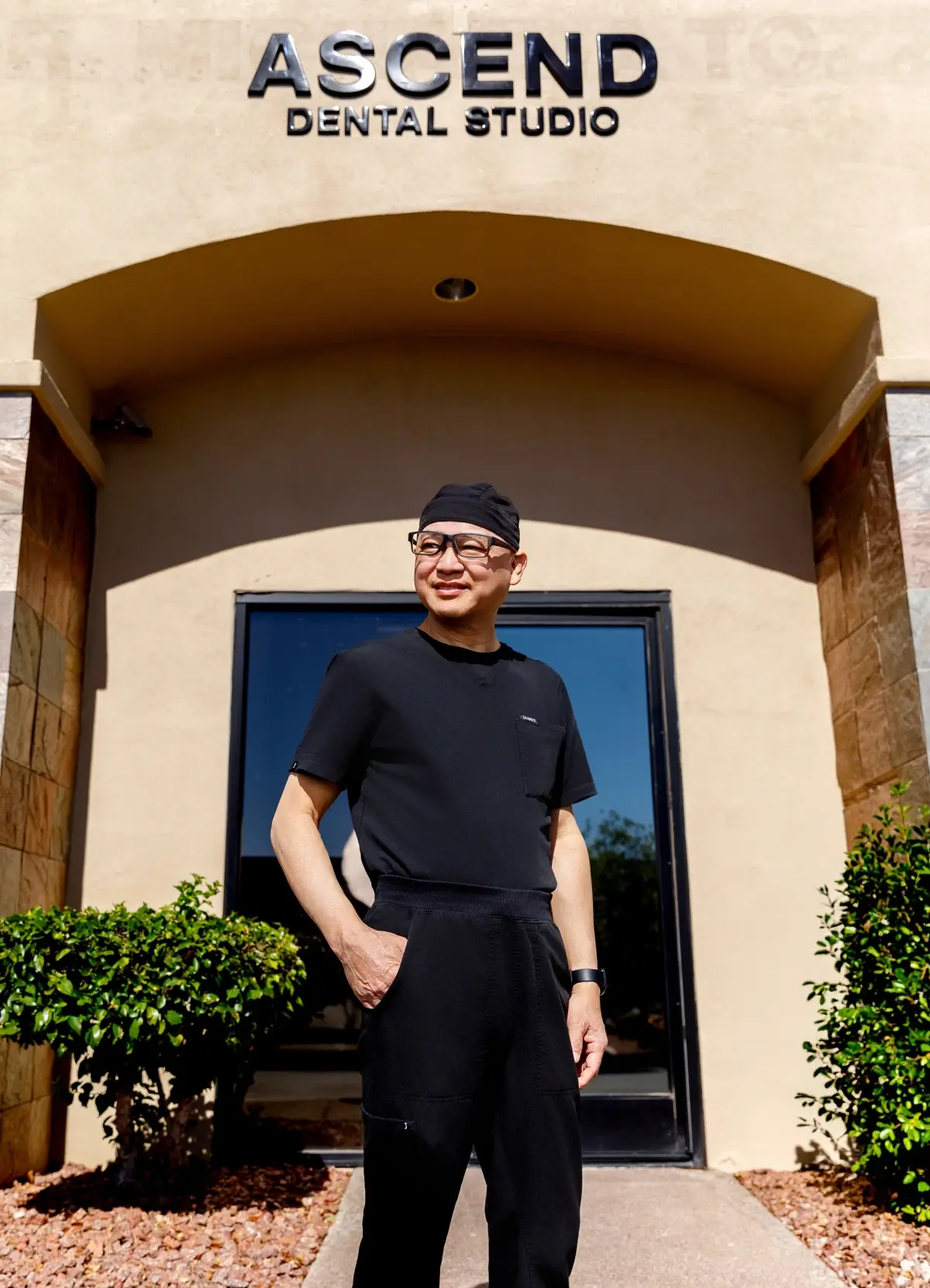 Dr. Timothy Luong stands at the entrance of Ascend Dental Studio in Henderson, Nevada.